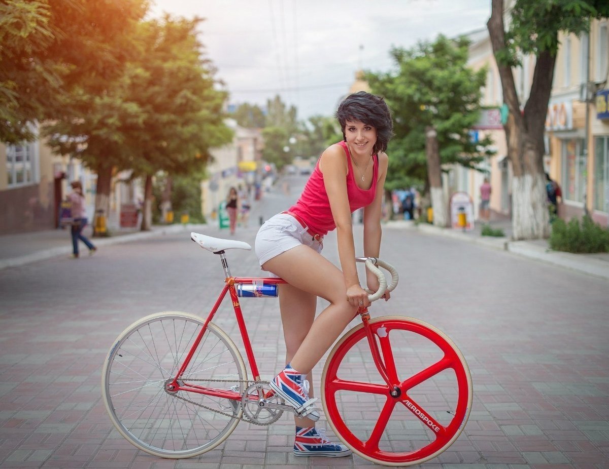 Nude asian model on a bicycle